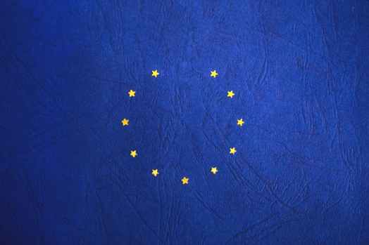 blue and yellow round star print textile